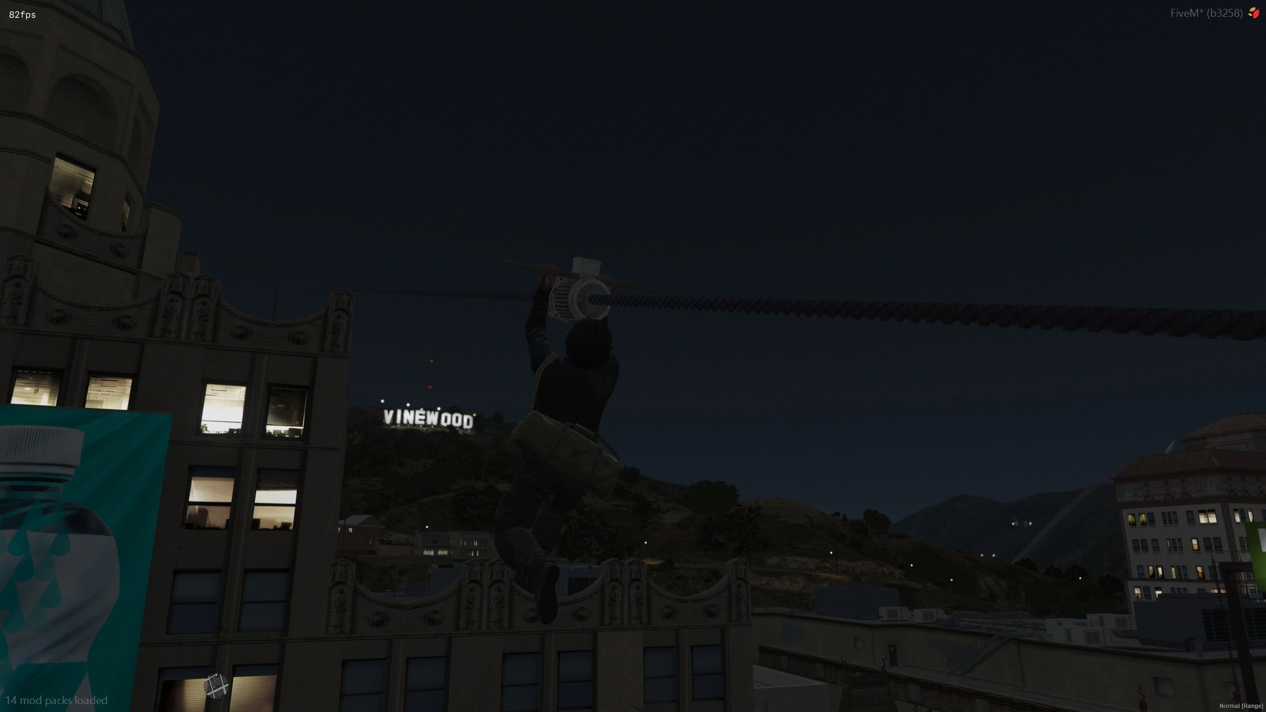 Player using a zipline across rooftops at night